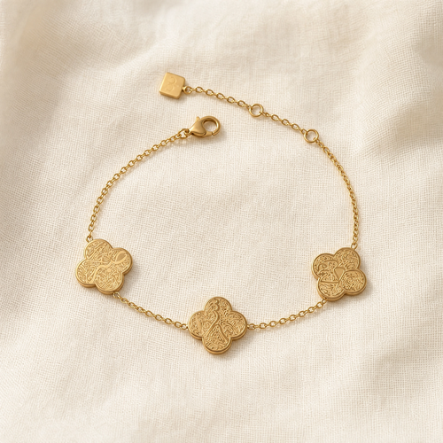 Ayat al-Kursi engraved bracelet, studio detail on warm stone